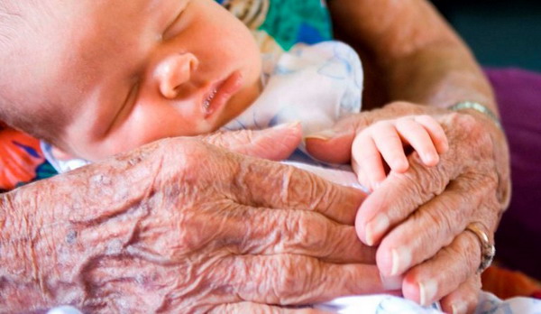 Baby in grandmothers hands