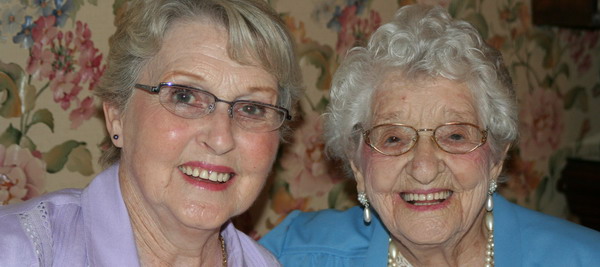 Two healthy older people smiling