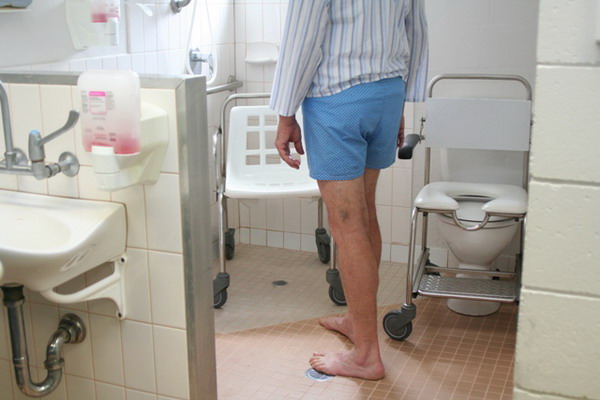 Patient's feet on bathroom floor