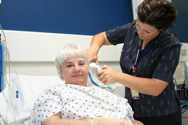 A nurse taking a patient's temperature